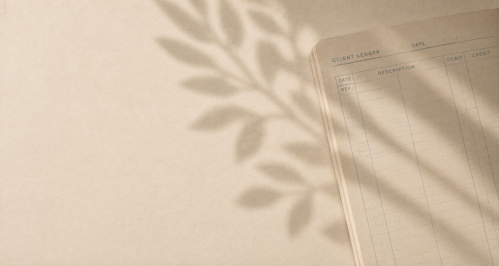 An open client ledger on warm paper, dappled with soft leaf shadow